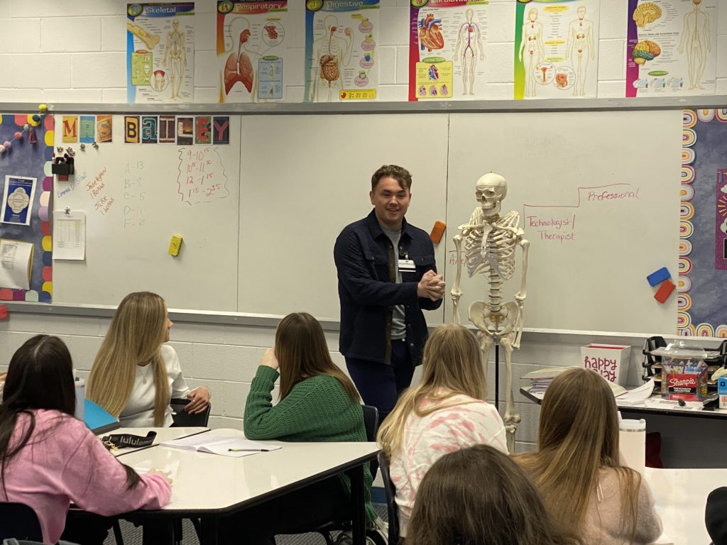 Dylon Baker speaking to Mrs. Bailey's FCSI class