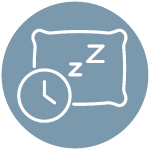 a clock and a pillow with z's on it